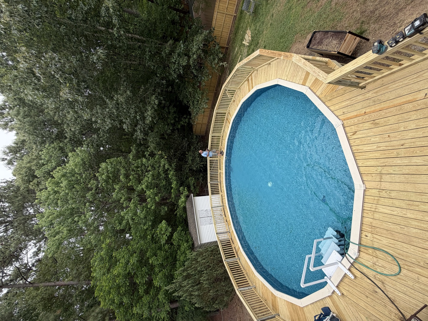 The same pool deck rebuilt in fresh lumber, seen from above