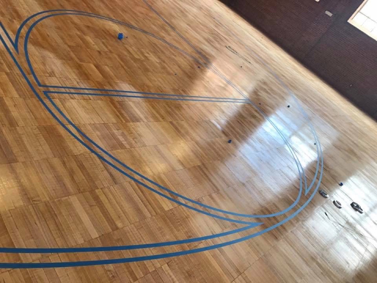 Game lines taped out on a freshly finished court floor