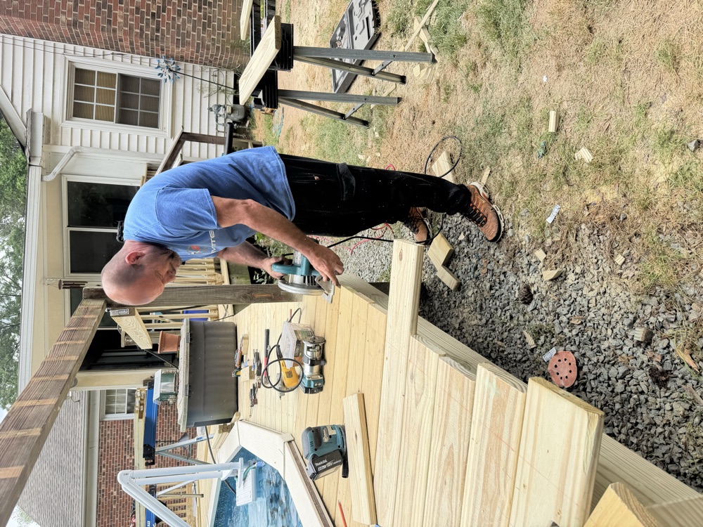 On the job at the miter saw during a deck rebuild